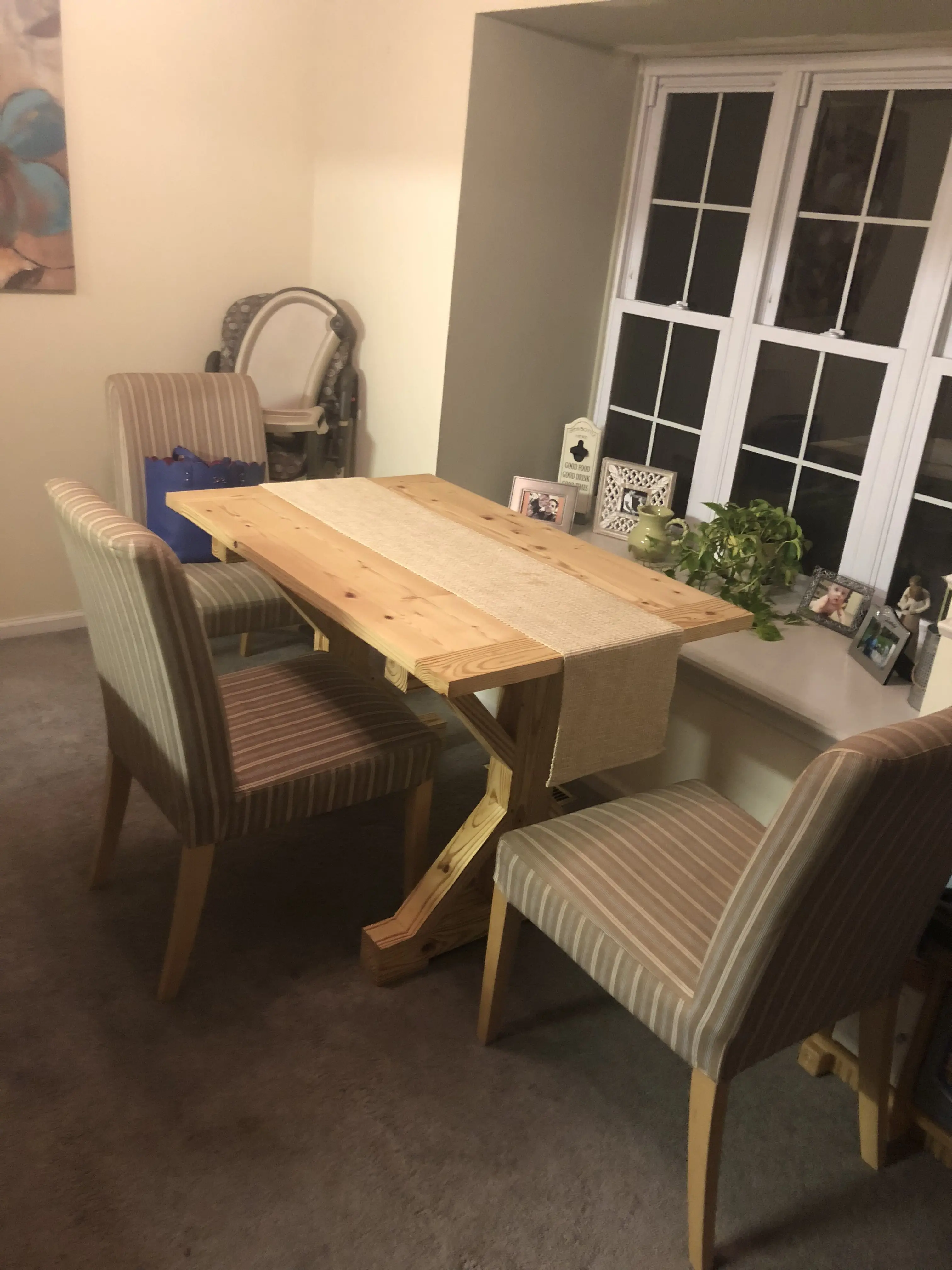 Finished wooden table set up in a dining room.